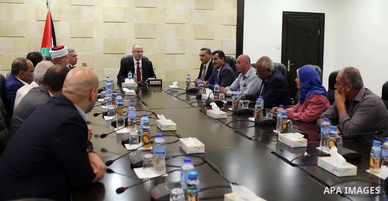 Palestinian Prime Minister Rami Hamdallah meets with a delegation from Jenin governorate, at his office in the West Bank city of Ramallah on August 2, 2017. Photo by Prime Minister Office
