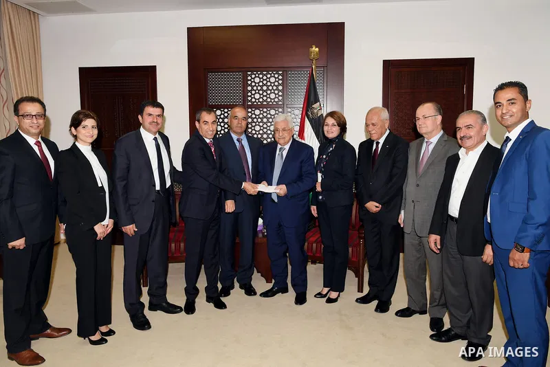 Palestinian President Mahmoud Abbas meets with a delegation from the Faten foundation, at his headquarter in the West Bank city of Ramallah, on August 2, 2017. Photo by Thaer Ganaim