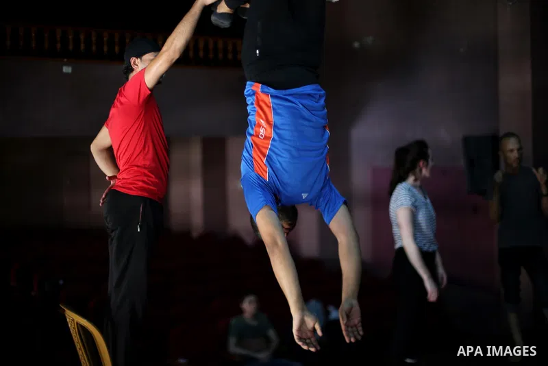 One of the Irish trainer Jennifer Higgins's students from Gaza circus to performs during an aerial silks practice class in Gaza City, on August 3, 2017. Photo by Mohammed Asad