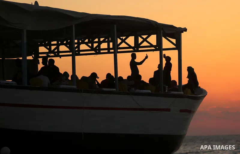 Palestinians are seen aboard "Lolo Rose" ship which has become a popular restaurant, on a beach in Gaza City on August 4, 2017. Photo by Ashraf Amra