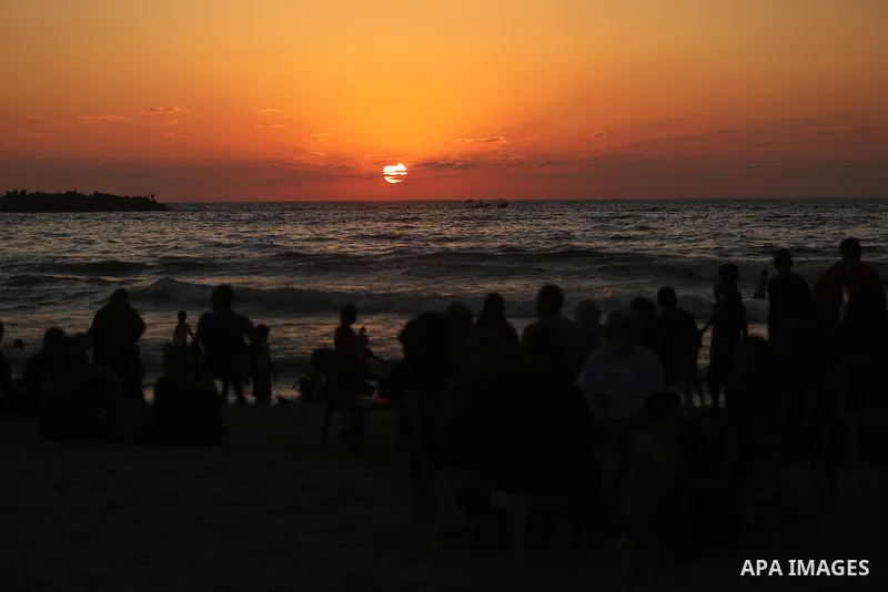 Palestinians enjoy their time at the beach of the Mediterranean sea on the coast of Gaza city on August 4, 2017. Photo by Ashraf Amra