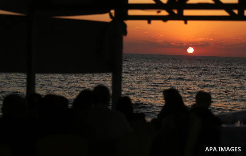 Palestinians are seen aboard "Lolo Rose" ship which has become a popular restaurant, on a beach in Gaza City on August 4, 2017. Photo by Ashraf Amra