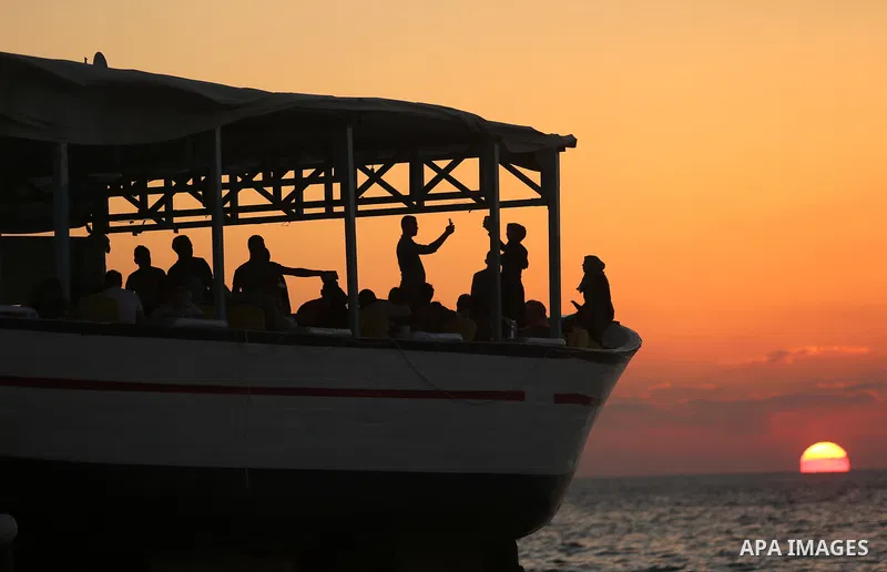 Palestinians are seen aboard "Lolo Rose" ship which has become a popular restaurant, on a beach in Gaza City on August 4, 2017. Photo by Ashraf Amra