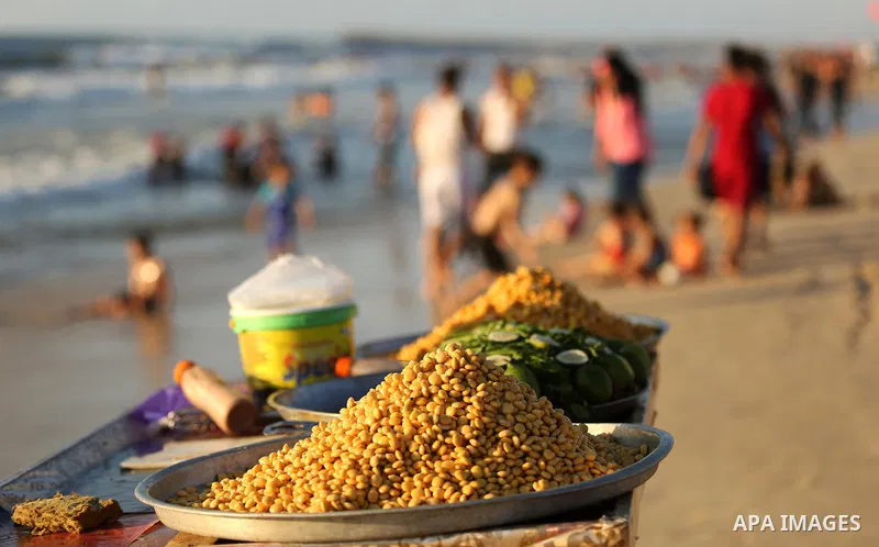 Palestinians enjoy their time at the beach of the Mediterranean sea on the coast of Gaza city on August 4, 2017. Photo by Ashraf Amra