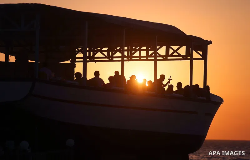 Palestinians are seen aboard "Lolo Rose" ship which has become a popular restaurant, on a beach in Gaza City on August 4, 2017. Photo by Ashraf Amra