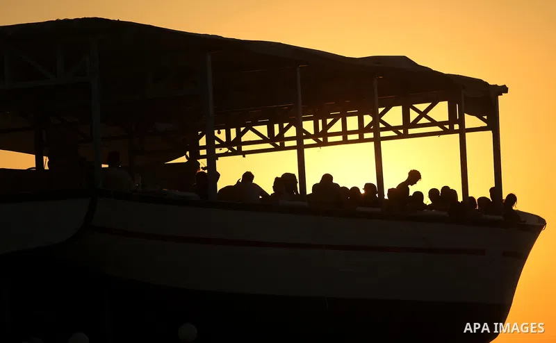 Palestinians are seen aboard "Lolo Rose" ship which has become a popular restaurant, on a beach in Gaza City on August 4, 2017. Photo by Ashraf Amra