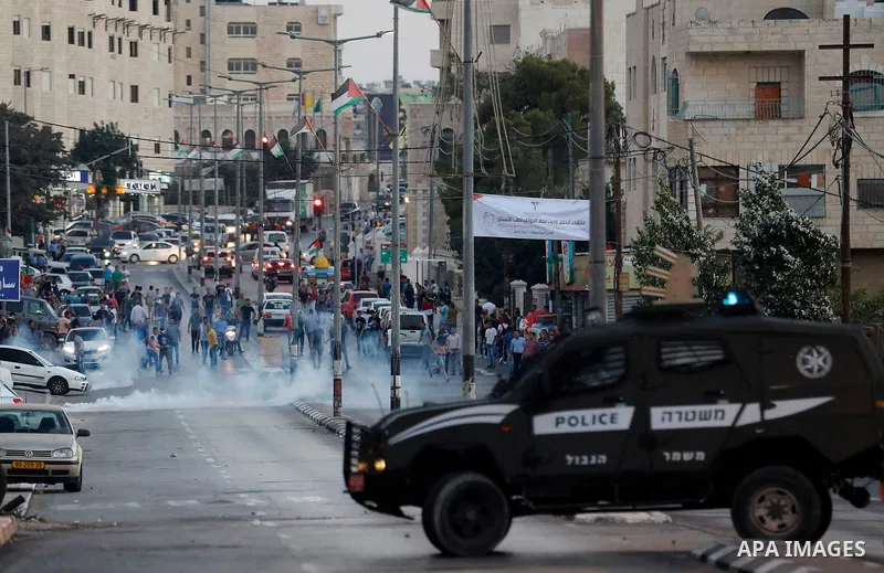 Palestinian protesters clash with Israeli security forces in the West Bank town of Bethlehem on July 19, 2017, following a demonstration against new Israeli security measures at the Al-Aqsa mosque compound in Jerusalem t...