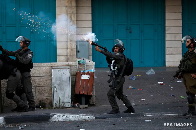 Palestinian protesters clash with Israeli security forces in the West Bank town of Bethlehem on July 19, 2017, following a demonstration against new Israeli security measures at the Al-Aqsa mosque compound in Jerusalem t...