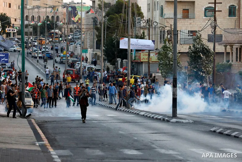 Palestinian protesters clash with Israeli security forces in the West Bank town of Bethlehem on July 19, 2017, following a demonstration against new Israeli security measures at the Al-Aqsa mosque compound in Jerusalem t...