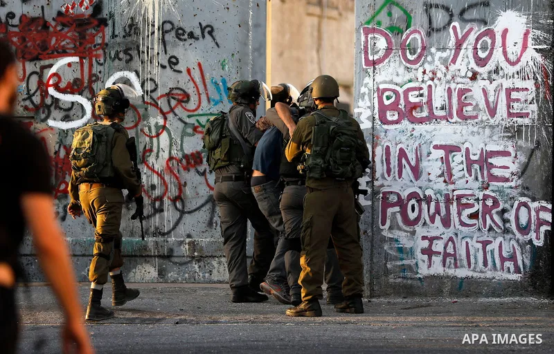 Palestinian protesters clash with Israeli security forces in the West Bank town of Bethlehem on July 19, 2017, following a demonstration against new Israeli security measures at the Al-Aqsa mosque compound in Jerusalem t...