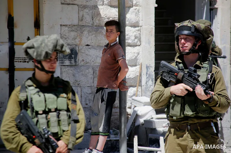 Israeli security forces confiscate files and cam recorders during a raid on the Palestinians committee of security in H2 area in the West bank city of Hebron on August 2, 2017. The H2 area is inhabited by approximately 3...