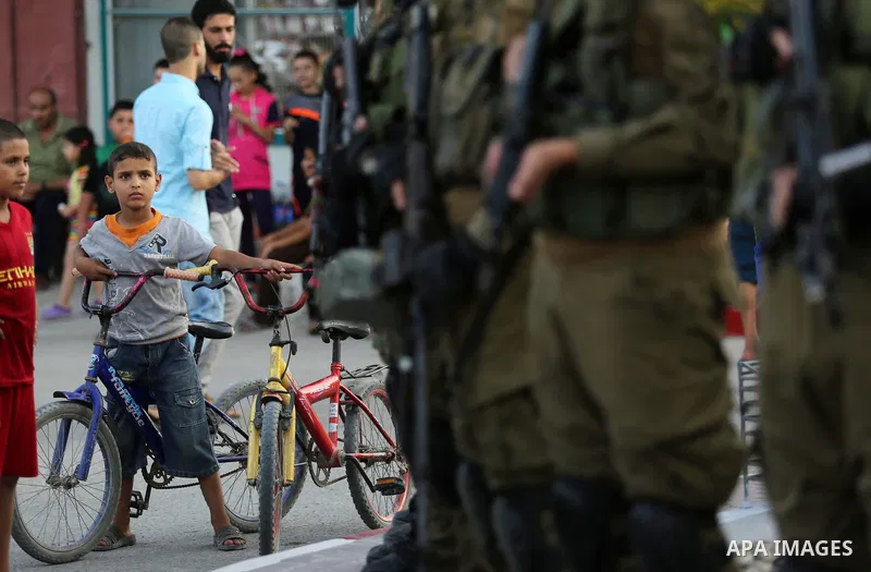 Members of the Ezzedine al-Qassam Brigades, the military wing of the Palestinian Islamist movement Hamas take part during the opening ceremony of Mazen Faqha square, in Nusseirat refugee camp, in the central Gaza Strip,...
