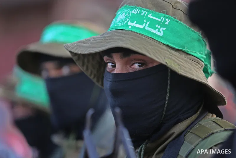 Members of the Ezzedine al-Qassam Brigades, the military wing of the Palestinian Islamist movement Hamas take part during the opening ceremony of Mazen Faqha square, in Nusseirat refugee camp, in the central Gaza Strip,...
