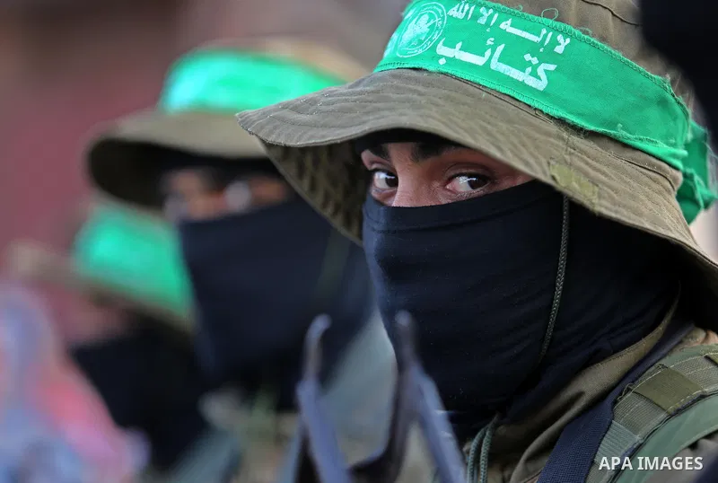 Members of the Ezzedine al-Qassam Brigades, the military wing of the Palestinian Islamist movement Hamas take part during the opening ceremony of Mazen Faqha square, in Nusseirat refugee camp, in the central Gaza Strip,...
