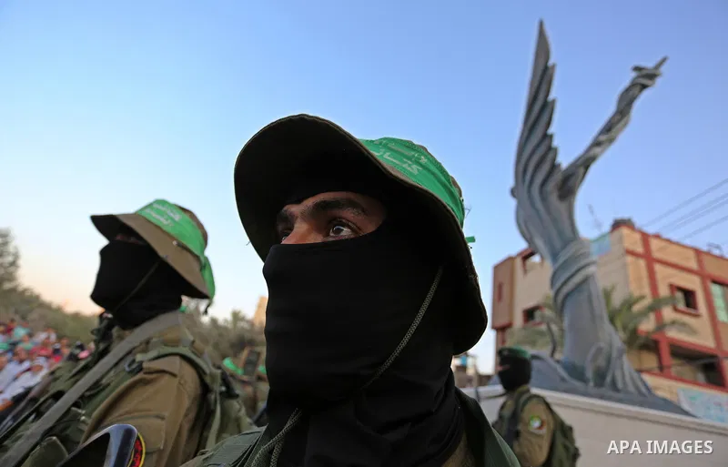 Members of the Ezzedine al-Qassam Brigades, the military wing of the Palestinian Islamist movement Hamas take part during the opening ceremony of Mazen Faqha square, in Nusseirat refugee camp, in the central Gaza Strip,...