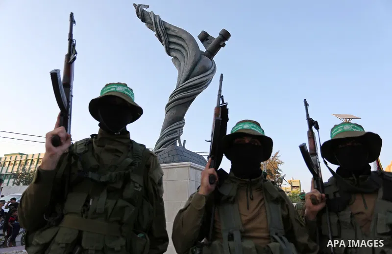 Members of the Ezzedine al-Qassam Brigades, the military wing of the Palestinian Islamist movement Hamas take part during the opening ceremony of Mazen Faqha square, in Nusseirat refugee camp, in the central Gaza Strip,...