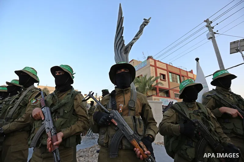 Members of the Ezzedine al-Qassam Brigades, the military wing of the Palestinian Islamist movement Hamas take part during the opening ceremony of Mazen Faqha square, in Nusseirat refugee camp, in the central Gaza Strip,...