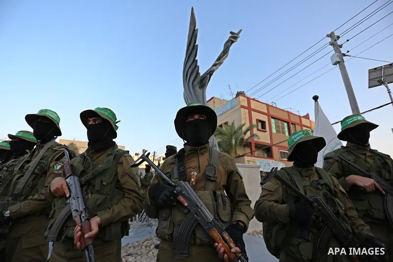 Members of the Ezzedine al-Qassam Brigades, the military wing of the Palestinian Islamist movement Hamas take part during the opening ceremony of Mazen Faqha square, in Nusseirat refugee camp, in the central Gaza Strip,...