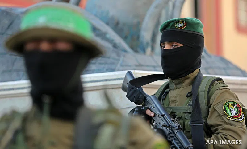Members of the Ezzedine al-Qassam Brigades, the military wing of the Palestinian Islamist movement Hamas take part during the opening ceremony of Mazen Faqha square, in Nusseir at refugee camp, in the central Gaza Strip,...
