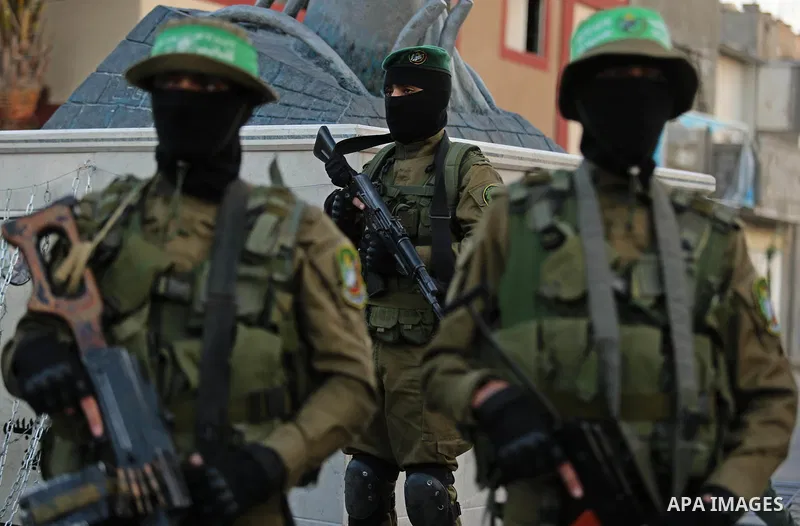 Members of the Ezzedine al-Qassam Brigades, the military wing of the Palestinian Islamist movement Hamas take part during the opening ceremony of Mazen Faqha square, in Nusseir at refugee camp, in the central Gaza Strip,...