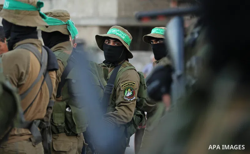 Members of the Ezzedine al-Qassam Brigades, the military wing of the Palestinian Islamist movement Hamas take part during the opening ceremony of Mazen Faqha square, in Nusseir at refugee camp, in the central Gaza Strip,...