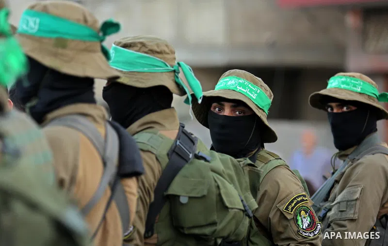 Members of the Ezzedine al-Qassam Brigades, the military wing of the Palestinian Islamist movement Hamas take part during the opening ceremony of Mazen Faqha square, in Nusseir at refugee camp, in the central Gaza Strip,...