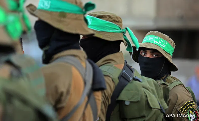 Members of the Ezzedine al-Qassam Brigades, the military wing of the Palestinian Islamist movement Hamas take part during the opening ceremony of Mazen Faqha square, in Nusseir at refugee camp, in the central Gaza Strip,...