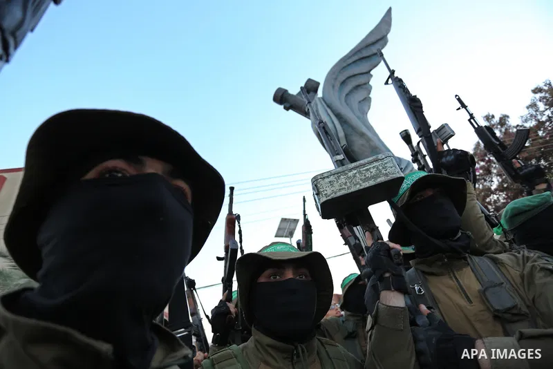 Members of the Ezzedine al-Qassam Brigades, the military wing of the Palestinian Islamist movement Hamas take part during the opening ceremony of Mazen Faqha square, in Nusseir at refugee camp, in the central Gaza Strip,...