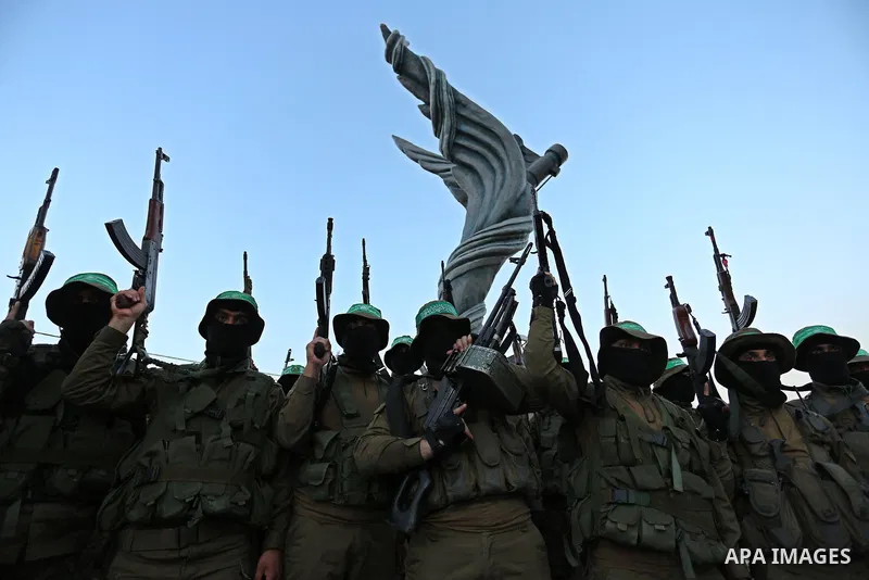 Members of the Ezzedine al-Qassam Brigades, the military wing of the Palestinian Islamist movement Hamas take part during the opening ceremony of Mazen Faqha square, in Nusseir at refugee camp, in the central Gaza Strip,...