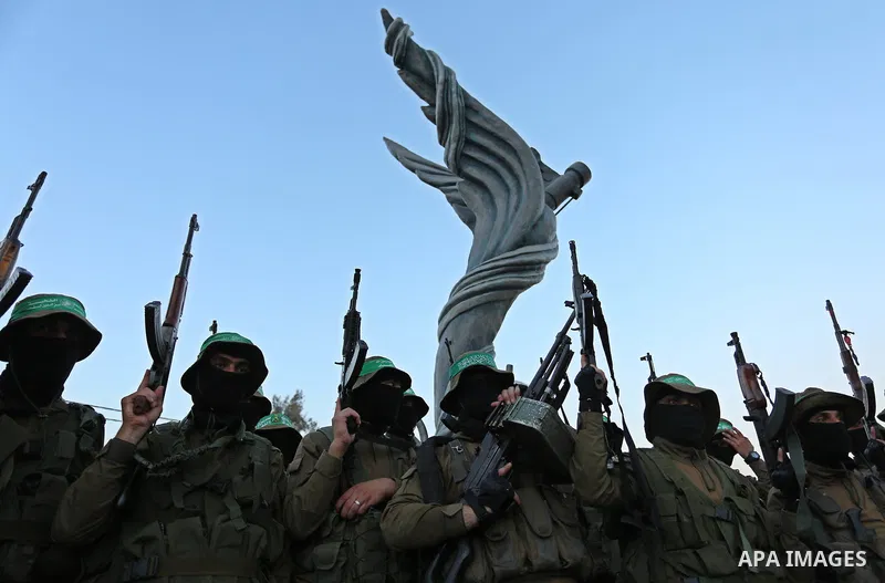 Members of the Ezzedine al-Qassam Brigades, the military wing of the Palestinian Islamist movement Hamas take part during the opening ceremony of Mazen Faqha square, in Nusseir at refugee camp, in the central Gaza Strip,...