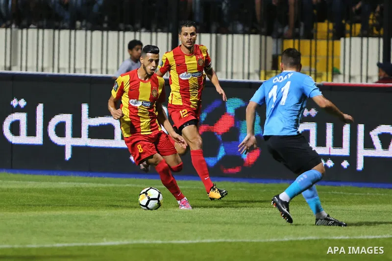 Jordan's Al-Faisaly players and Tunis Esperance players compete during the Arab Club championship final match in Alexandria Stadium on August 6, 2017. Photo by Stringer