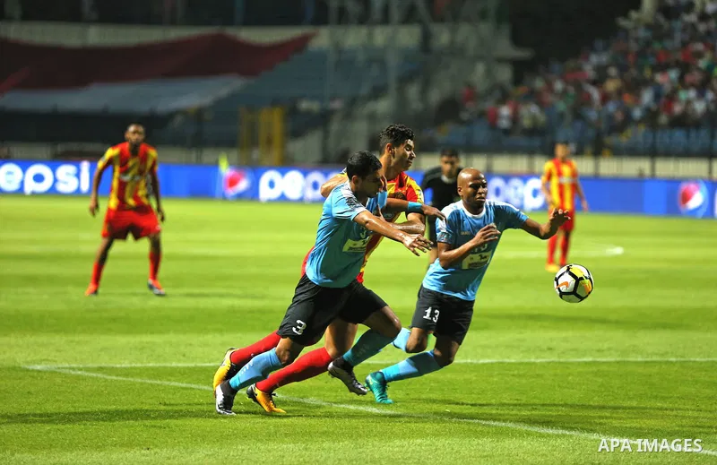 Jordan's Al-Faisaly players and Tunis Esperance players compete during the Arab Club championship final match in Alexandria Stadium on August 6, 2017. Photo by Stringer