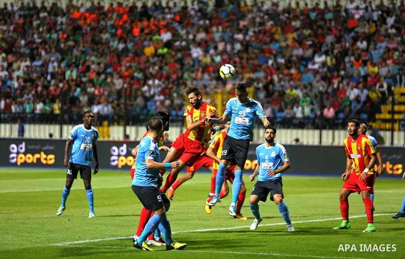 Jordan's Al-Faisaly players and Tunis Esperance players compete during the Arab Club championship final match in Alexandria Stadium on August 6, 2017. Photo by Stringer