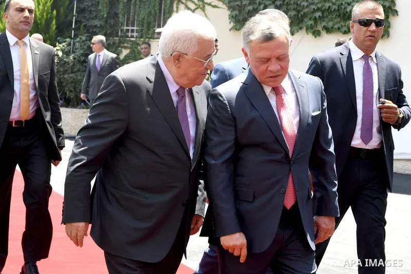 Jordan's King Abdullah II and Palestinian president Mahmud Abbas observes the honor guard during a visit in the West Bank city of Ramallah on August 7, 2017. Jordan's King began a rare visit to the occupied West Bank to...