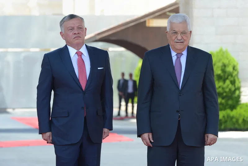 Jordan's King Abdullah II and Palestinian president Mahmud Abbas observes the honor guard during a visit in the West Bank city of Ramallah on August 7, 2017. Jordan's King began a rare visit to the occupied West Bank to...