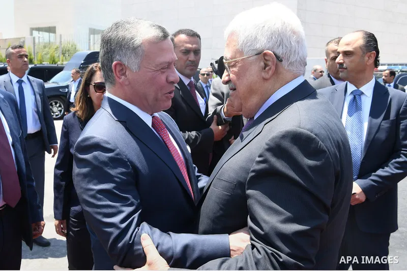 Jordan's King Abdullah II and Palestinian president Mahmud Abbas observes the honor guard during a visit in the West Bank city of Ramallah on August 7, 2017. Jordan's King began a rare visit to the occupied West Bank to...