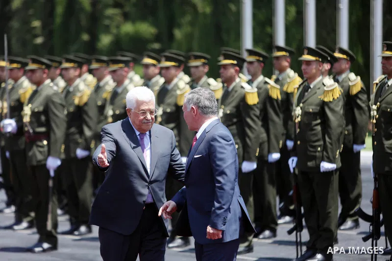Jordan's King Abdullah II and Palestinian president Mahmud Abbas observes the honor guard during a visit in the West Bank city of Ramallah on August 7, 2017. Jordan's King began a rare visit to the occupied West Bank to...