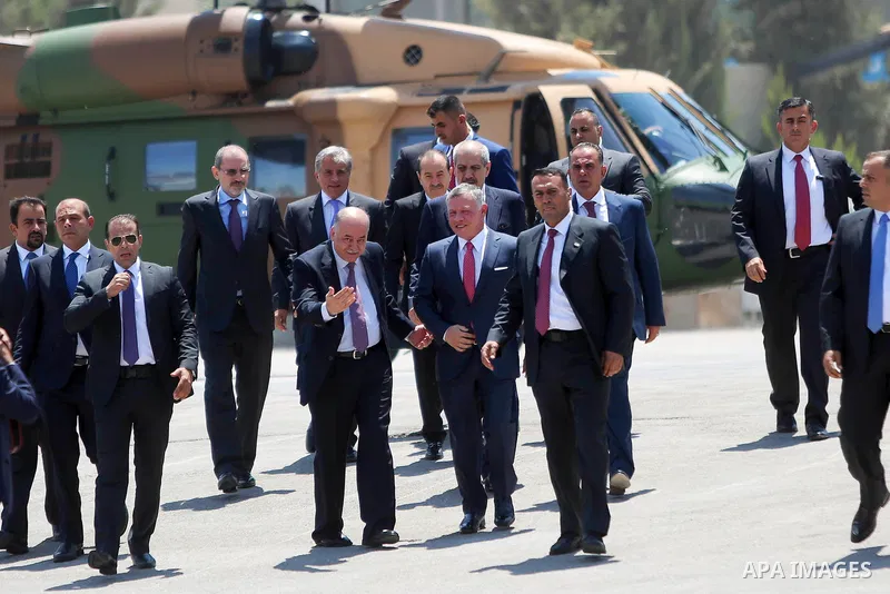 Jordan's King Abdullah II observes the honor guard during a visit in the West Bank city of Ramallah on August 7, 2017. Jordan's King began a rare visit to the occupied West Bank to meet With Palestinain president, amid s...