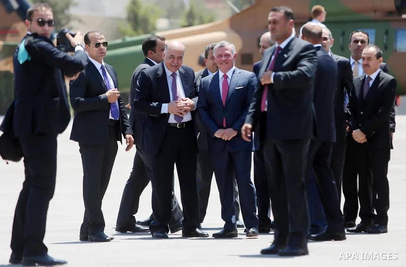 Jordan's King Abdullah II observes the honor guard during a visit in the West Bank city of Ramallah on August 7, 2017. Jordan's King began a rare visit to the occupied West Bank to meet With Palestinain president, amid s...