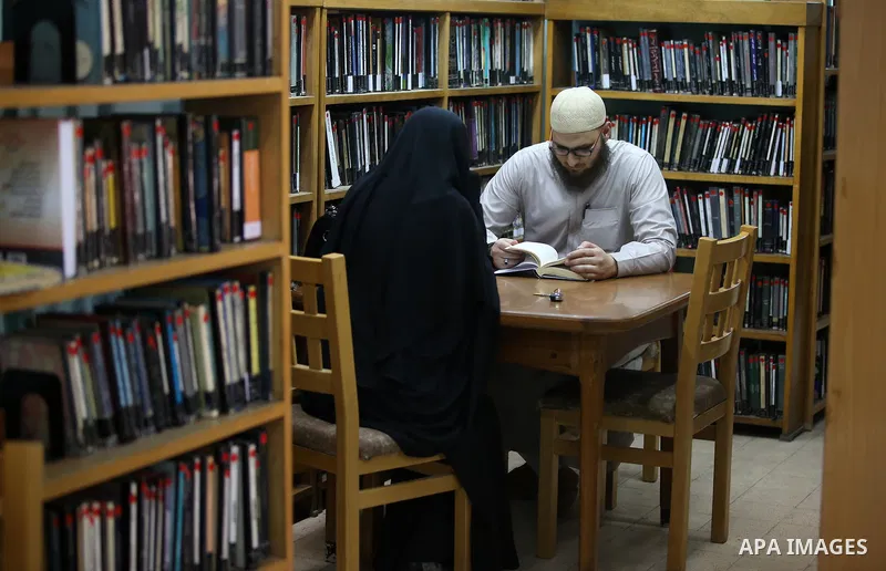 Palestinian researchers read books at Nablus public library in the West Bank city of Nablus, on August 6, 2017. Nablus public library, the largest, and the oldest, in all of Palestine, opened in 1960, and library include...