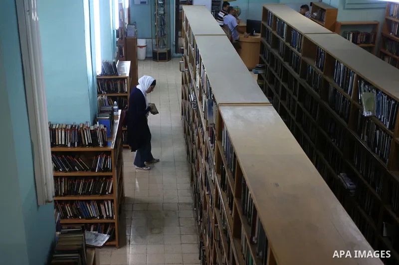 A Palestinian researcher selects a book at Nablus public library in the West Bank city of Nablus, on August 6, 2017. Nablus public library, the largest, and the oldest, in all of Palestine, opened in 1960, and library in...