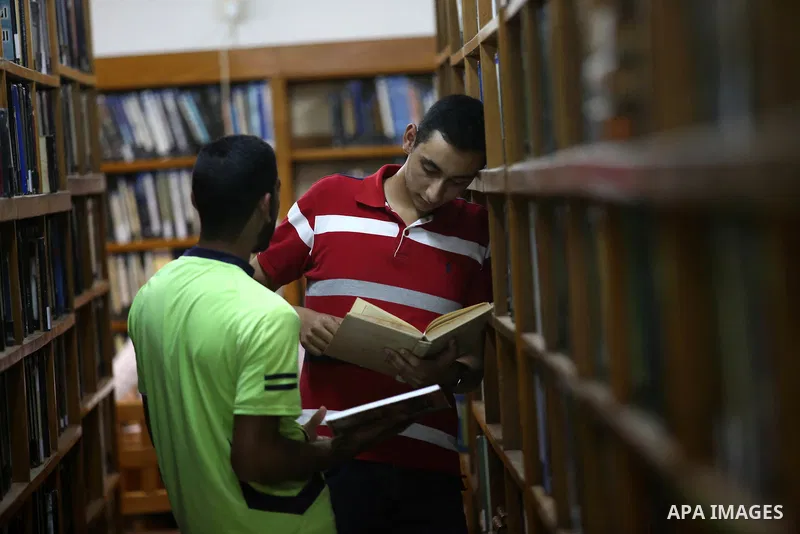 Palestinian students read books at Nablus public library in the West Bank city of Nablus, on August 6, 2017. Nablus public library, the largest, and the oldest, in all of Palestine, opened in 1960, and library includes a...