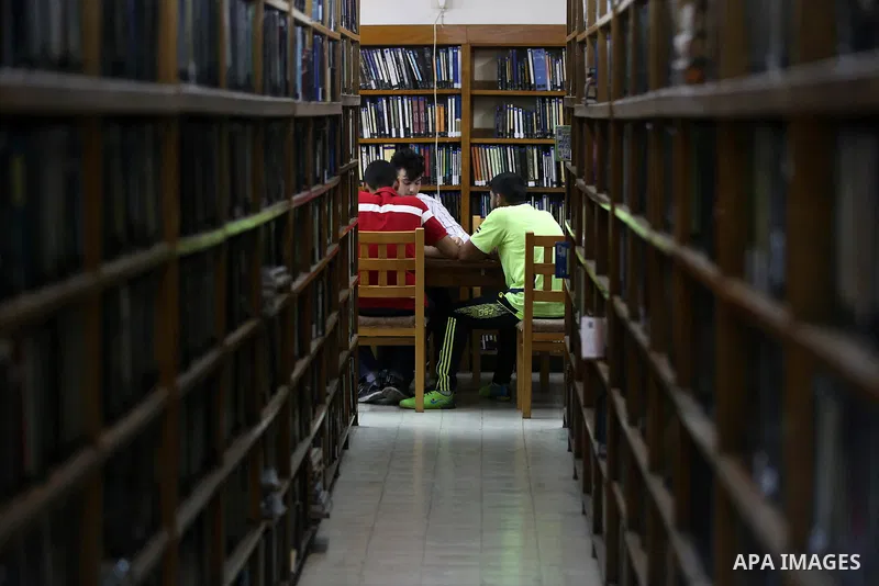 Palestinian students read books at Nablus public library in the West Bank city of Nablus, on August 6, 2017. Nablus public library, the largest, and the oldest, in all of Palestine, opened in 1960, and library includes a...