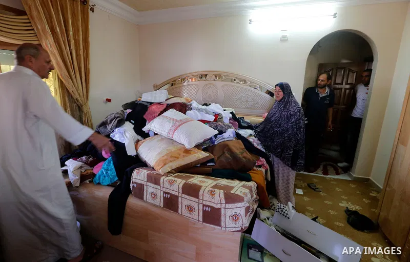 Palestinians check a damage after the Israeli army stormed the house and arrested two people, in the West Bank city of Hebron, on August 8, 2017. Israeli army stormed two house in the last night in hebron search for weap...