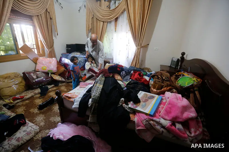 Palestinians check a damage after the Israeli army stormed the house and arrested two people, in the West Bank city of Hebron, on August 8, 2017. Israeli army stormed two house in the last night in hebron search for weap...
