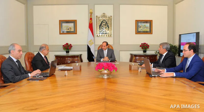 Egyptian President Abdel Fattah al-Sisi meets with Prime Minister Sharif Ismail in Cairo, Egypt on August 8, 2017. Photo by Egyptian President Office