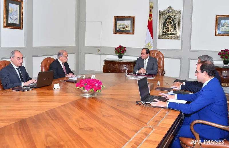 Egyptian President Abdel Fattah al-Sisi meets with Prime Minister Sharif Ismail in Cairo, Egypt on August 8, 2017. Photo by Egyptian President Office
