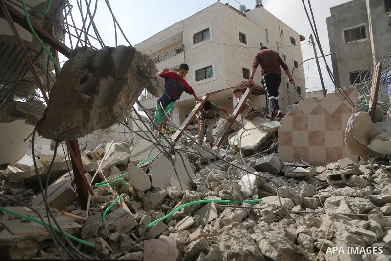 People walk through the rubble of the house of a Palestinian assailant after it was demolished by Israeli troops in the West Bank village of Deir Abu Mashal, near Ramallah August 10, 2017. Photo by Shadi Hatem