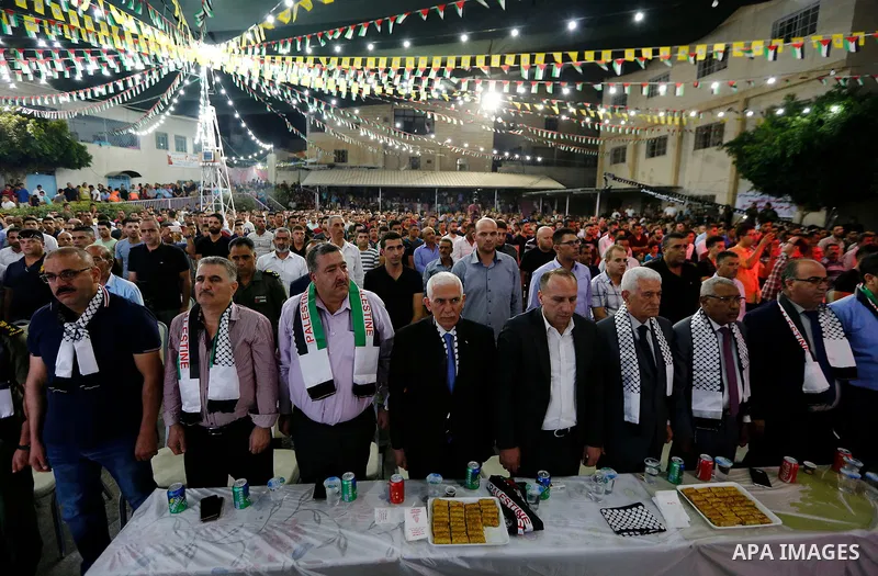 Palestinians take part in a mass wedding funded by Palestinian President Mahmoud Abbas in the West Bank village of Tafouh, east of Hebron, on August 10, 2017. Photo by Wisam Hashlamoun