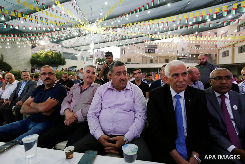 Palestinians take part in a mass wedding funded by Palestinian President Mahmoud Abbas in the West Bank village of Tafouh, east of Hebron, on August 10, 2017. Photo by Wisam Hashlamoun